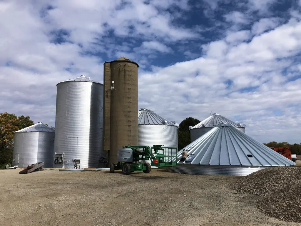 Grain bins and construction equipment at a BAI project site
