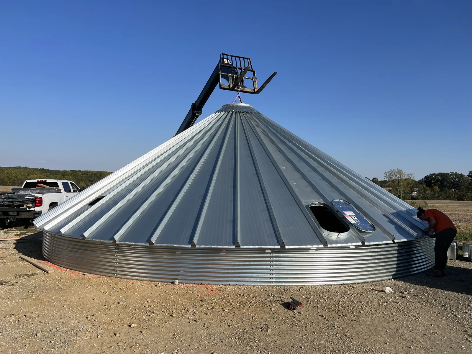 A grain bin roof during assembly, used as a development placeholder
